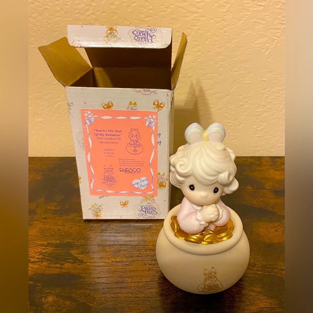 Artwork by the late Sam Butcher. Precious Moments 
Figurine.